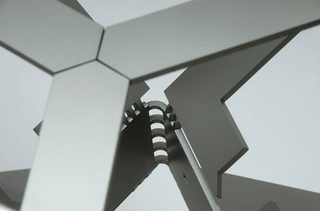 Illustration for article titled Futuristic Origami Desk Cut and Folded from a Single Sheet of Steel